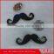 black epoxy with silver base mustache-shaped metal brooch