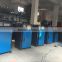 Dryer material hoppers and material conveying systems and snakes and ladder materials