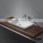 white matte resin basins, modern art above counter top basin