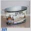 large colorful tin pail