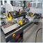Double-head mitre saw for PVC window processing