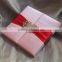 Hot sale luxurious pink silk hardcover wedding invitations with red ribbons&rhinestone brooches