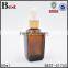 square 50 ml amber glass vial with black press dropper