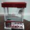 Children loved indoor coin operated claw crane machine game with music