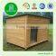 Wooden outdoor dog house with patio