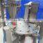 Rotary plastic cup filler and sealer machine
