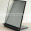 unframed small standing table mirror