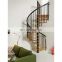 White iron spiral stairs with black handrails