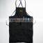 Black canvas work apron with crossback straps