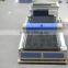 Fabric laser cutter with auto feeder and calibration system