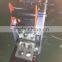 juice packaging machine semi automatic one to four cup sealing machine