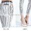 The ladies fashion sexy grid render nine points pencil feet carry buttock casual tights leggings pants for women