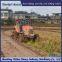 Wheel tractor modified with triangular track wheels for anti-skid and anti sinking