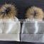 flat knit cashmere beanie hat with raccoon fur pompoms