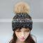 Adult size black striped pattern knitting hat with real raccoon fur bobble