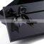 High quality clothing presents in black cardboard boxes