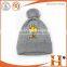 high quality knitted logo 100% acrylic pom pom beanie for woman