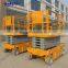 Moving scissor lift platform with battery for outdoor
