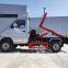 Hook arm garbage truck