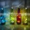 glass wine bottle candle holder with LED string lights