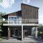 New Prefabricated Industrial Concrete House Decorated with Wood Louvres 2 Storey Modern House in Thailand