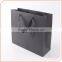 Luxury matte black shopping paper bag with logo embossing for clothing packaging