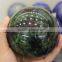 Carved polished epidote gemstone sphere