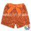 Wholesale boutique kids girl clothes orange sequin cotton ribbon bow sequin shorts baby summer shorts