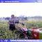 East operate people working ginger harvester machine