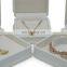Factory direct supply white color leather convex edge jewelry box ring box