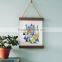Wooden poster hanger