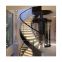 curved stainless steel staircase with glass balustrade