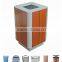 Metal and wooden outdoor trash bin