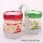 2pcs round glass jar with nice decal in a metal rack