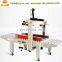 Price of carton box packing strapping machine both belt drive Paper box sealing machine