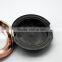 Empty compact powder container with metallic finish