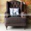 High back vintage single seater sofa chair in living room