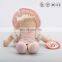 Plush pretty baby doll with pink dress and hat