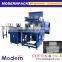 Automatic shrink film packaging machine