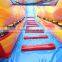 volcano lava themed inflatable water slide with a bigger water pool