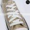 In stock gold canvas shoe woman