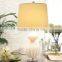 wholesale high end chrome round base glass table lamp with polished surface and barrel linen shade