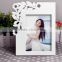 White carved wooden collage photo frames