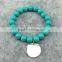 Stretch colorful glass beads bracelet with silver round disc monogram charm