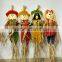 Paper straw and fabric scarecrow for autumn and harvest decoration