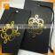 Hot sale custom black card paper hang tag/gold foil center folded swing tag