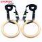 Wooden gymnastic rings with gym wrist straps and adjustable strap buckle for crossfit