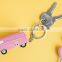 pink car shape keychains, custom made car keychains, custom made pink car shape keychains manufacture