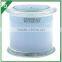 Multi colored scented candle in glass jar with glass lid