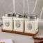 ceramic canister set with stainless lid & wooden stand